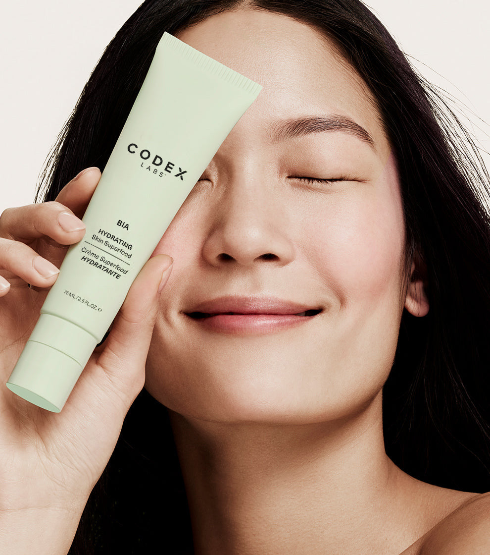 Image of woman holding Bia Skin Superfood Moisturizer - Clean Skincare Products by Codex Beauty | Codex Labs