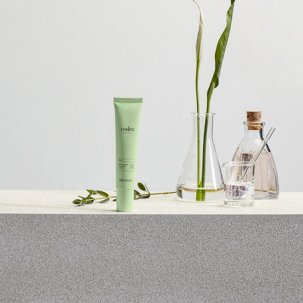 BiaComplex® skin cream displayed on a stone background.