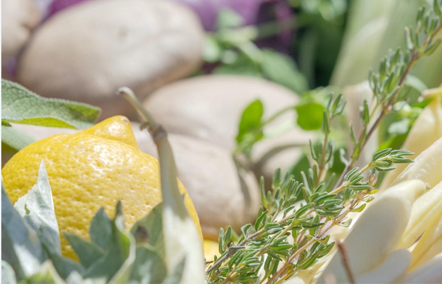 A selection of plant based ingredients - Lemons, potatoes, rosemary 