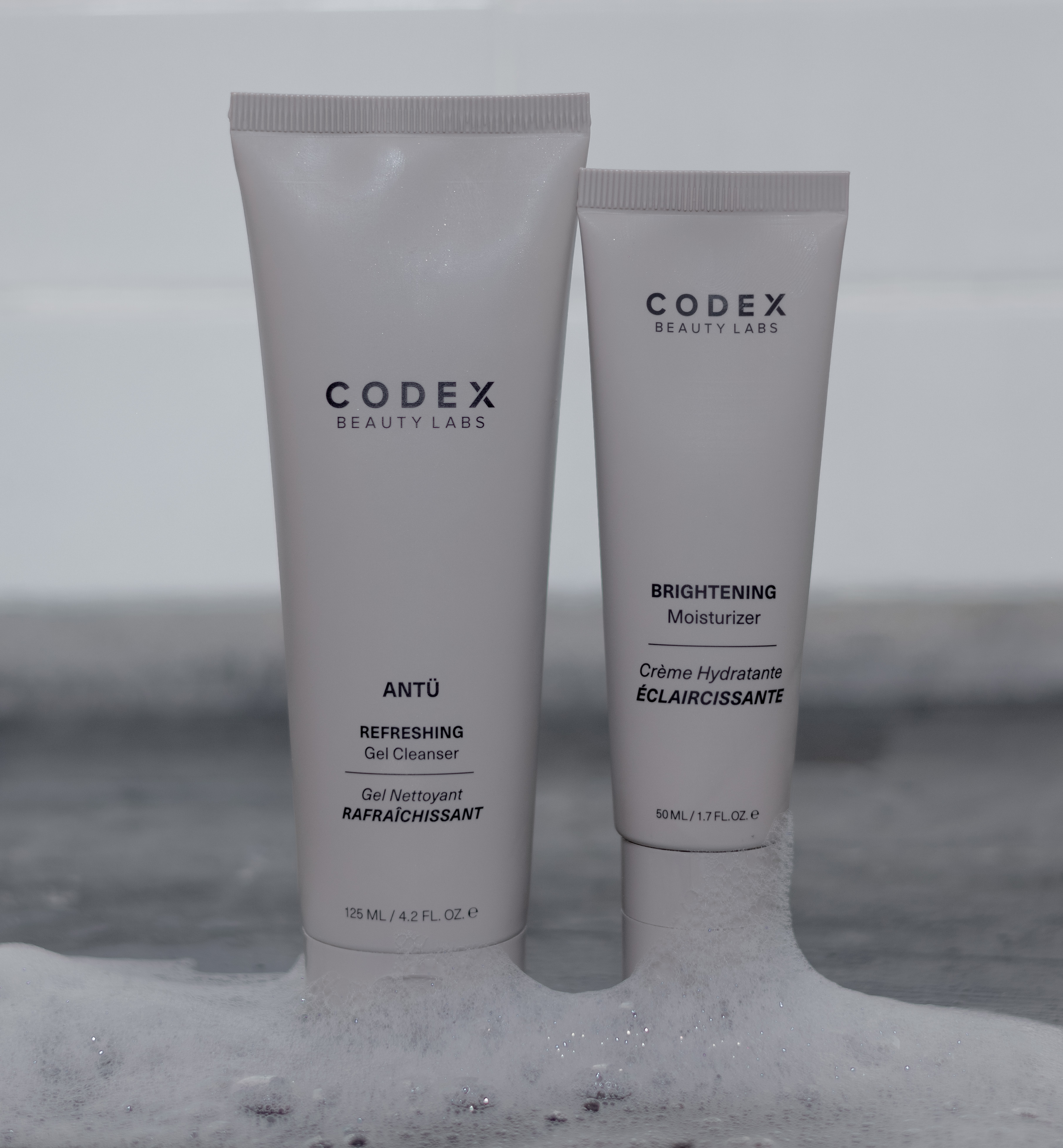 Codex Beauty Labs Antu Refreshing Gel Cleanser and Antu Brightening Moisturizer placed on the side in a bathroom