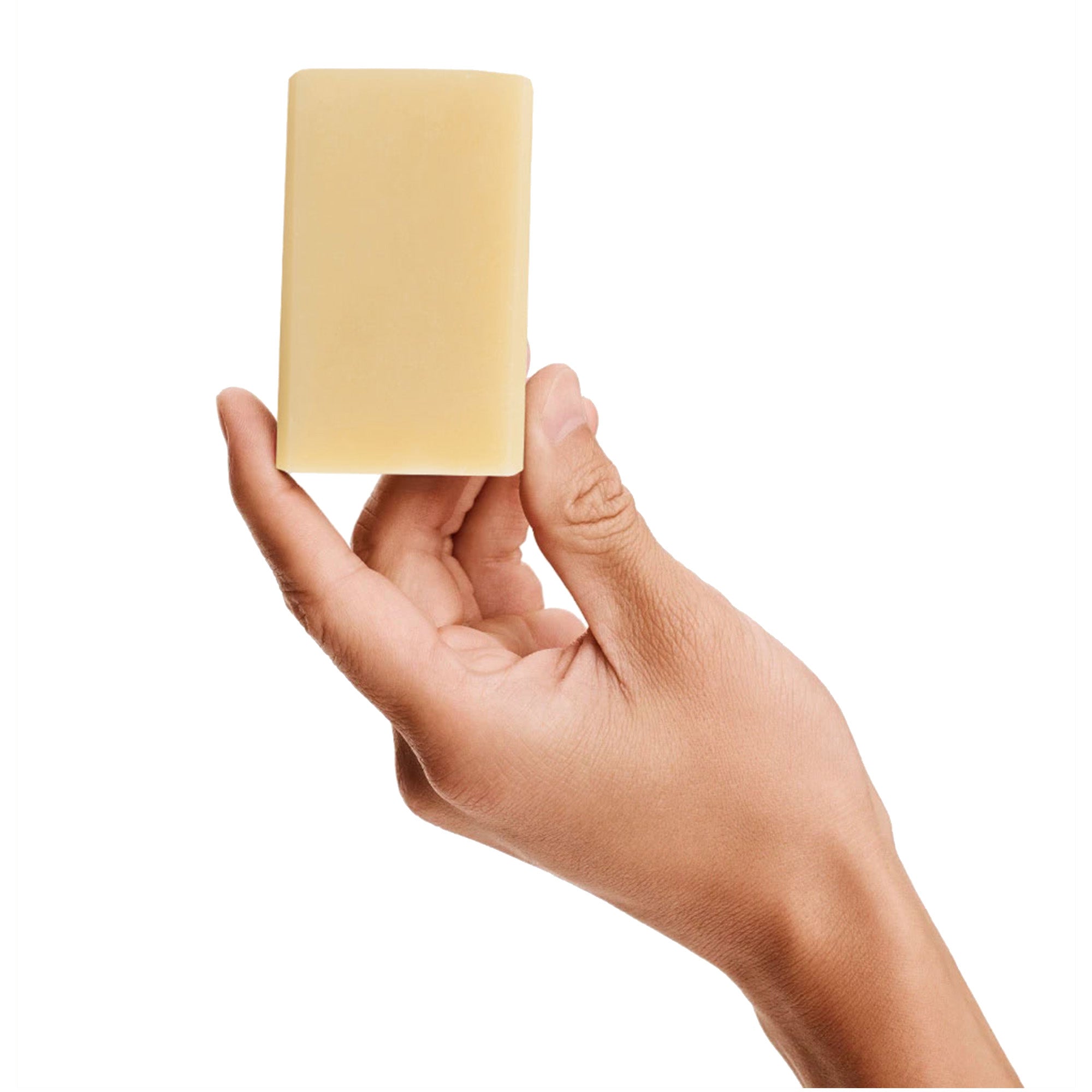 Image of a model holding Antü Refreshing bar of soap.