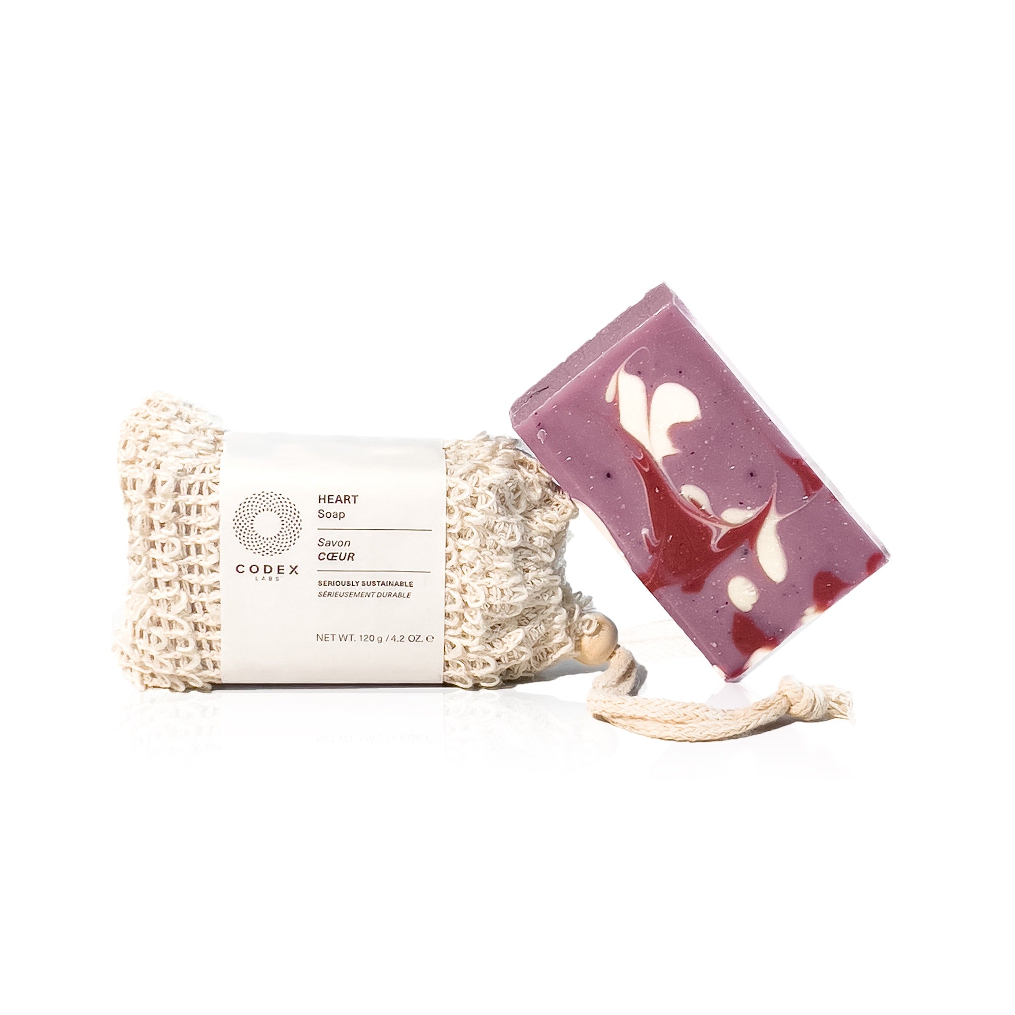 Heart soap leaning on a white background.